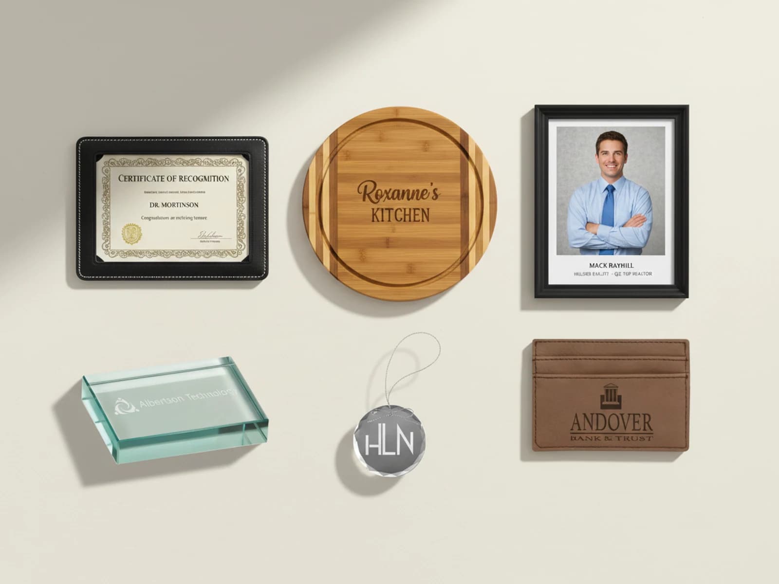 Personalized Gifts — Leatherette journals, cutting boards, frames, ornaments, glass pieces.